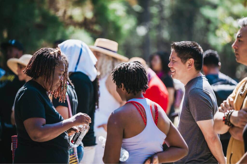 equitable food oriented development members talking together at an event