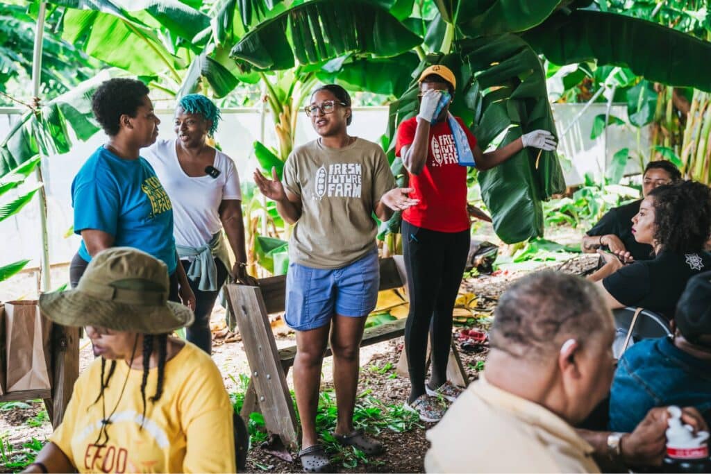 group of efod members taking a tour of an organic farm